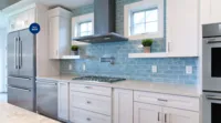 26075860_thermador-luxury-kitchen-appliance-packages-gas-cooktop-white-blue-subway-tile-kitchen_2640x1465.webp