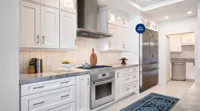 26075864_thermador-luxury-kitchen-appliance-packages-gas-cooktop-wall-oven-white-bright-kitchen_2640x1465.webp