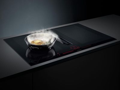 Food cooking on an induction vented hob