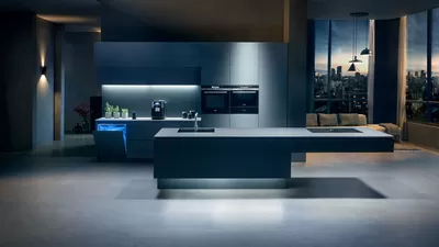 Modern spacious kitchen with built in appliances and city view