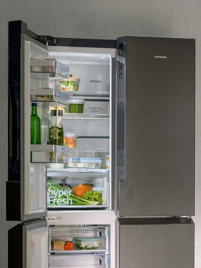 Half open fridge door showing interior