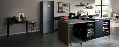 Spacious kitchen with multiple dark Siemens appliances