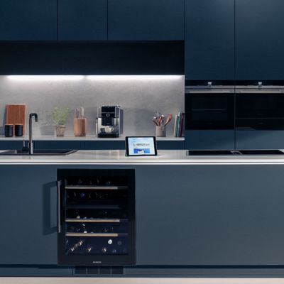 Kitchen with an Amazon echo show, wine cooler and coffee machine in the background