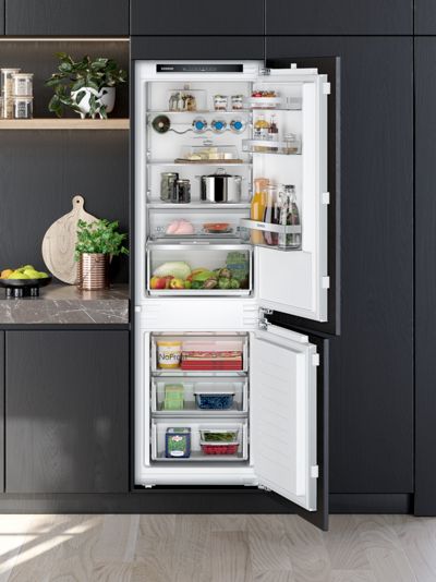 Half open fridge door showing interior