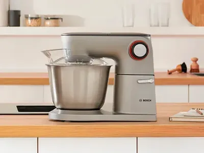 A side shot of a silver Series 8 OptiMUM stand mixer.