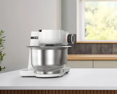 A front shot of a white Series 2 stand mixer on a kitchen counter.