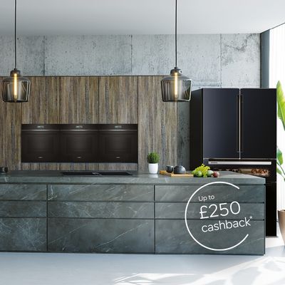 Dark themed spacious kitchen with multiple Siemens appliances