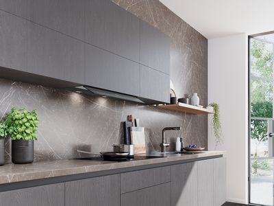 Elegante cappa sopra pentola che cuoce a fuoco lento con illuminazione d'ambiente. 