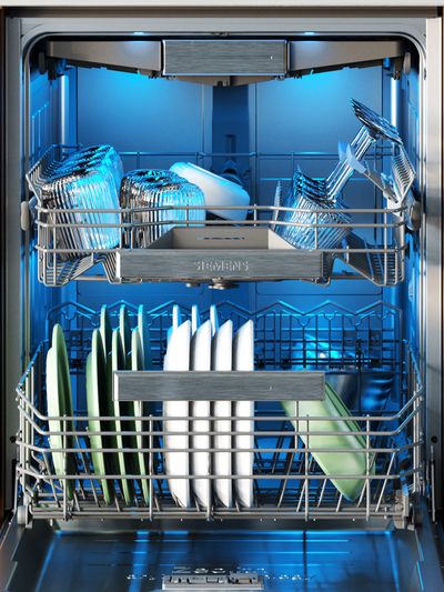 Interior of a dishwasher with blue lighting, showcasing stacked plates and containers in organized metal racks.