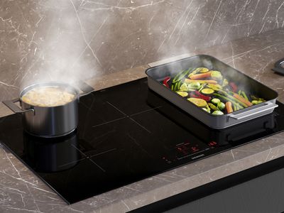 Induction hob with pans cooking