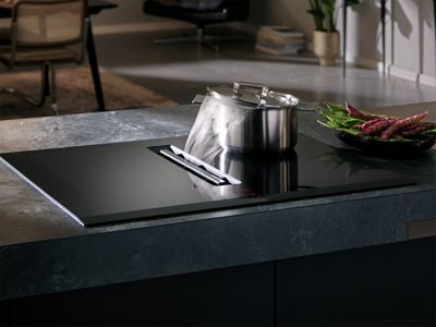 Venting hob extracting steam