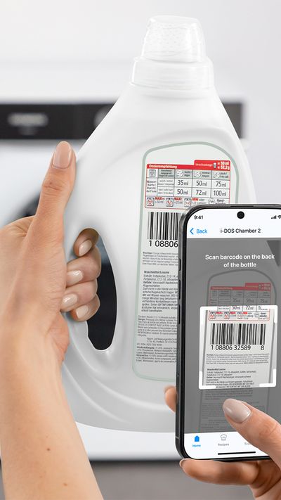 Person filling up Siemens washing machine detergent area with blue liquid