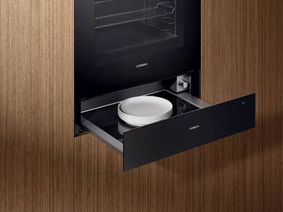 Open warming drawer underneath built in oven