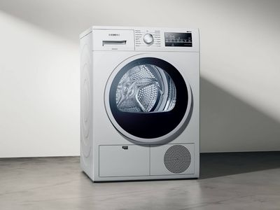 Siemens dryer on plain wall background