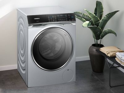 Siemens washer dryer on plain wall background