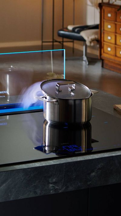 Pan on hob with steam coming out going down into glassdraftAir