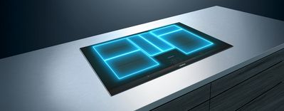 &Scaron;t&iacute;hla, modern&aacute; kuchynsk&aacute; linka s žiariacimi modr&yacute;mi LED svetlami tvoriacimi geometrick&eacute; vzory.