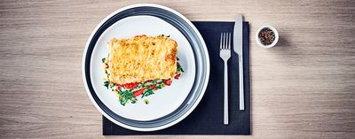 Lasagne Tricolore on a plate with cutlery