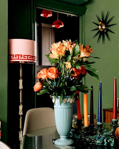 Maximalist flower arrangement on a dining table