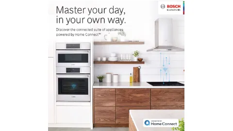 Bosch kitchen appliances with Home Connect, including ovens and a hood on display.