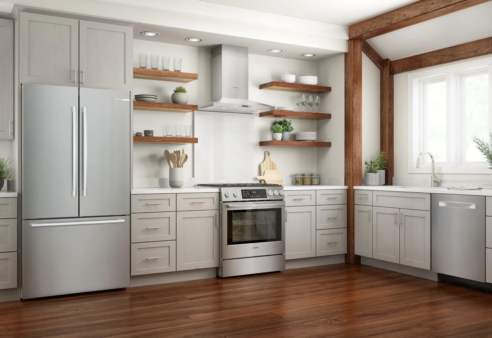 Modern kitchen featuring gray cabinets, stainless steel appliances, and wooden shelves, accented by natural light and a warm wooden floor.