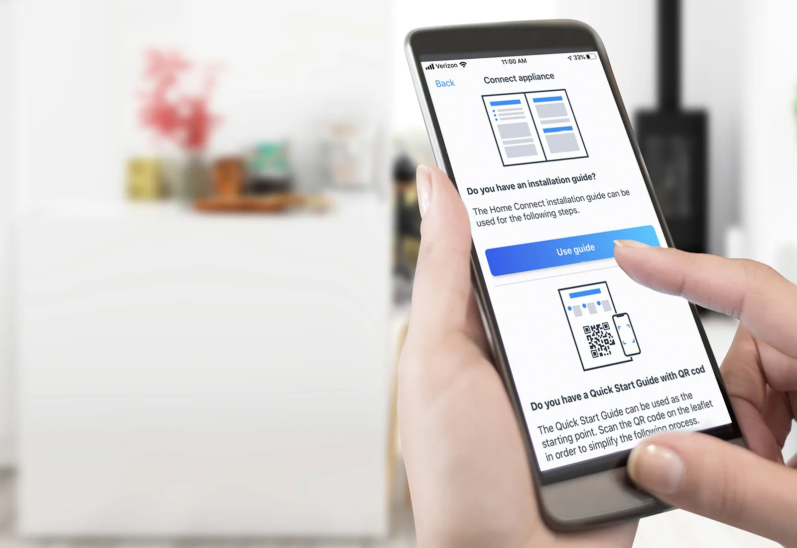 Person on phone looking at Home Connect™ app 