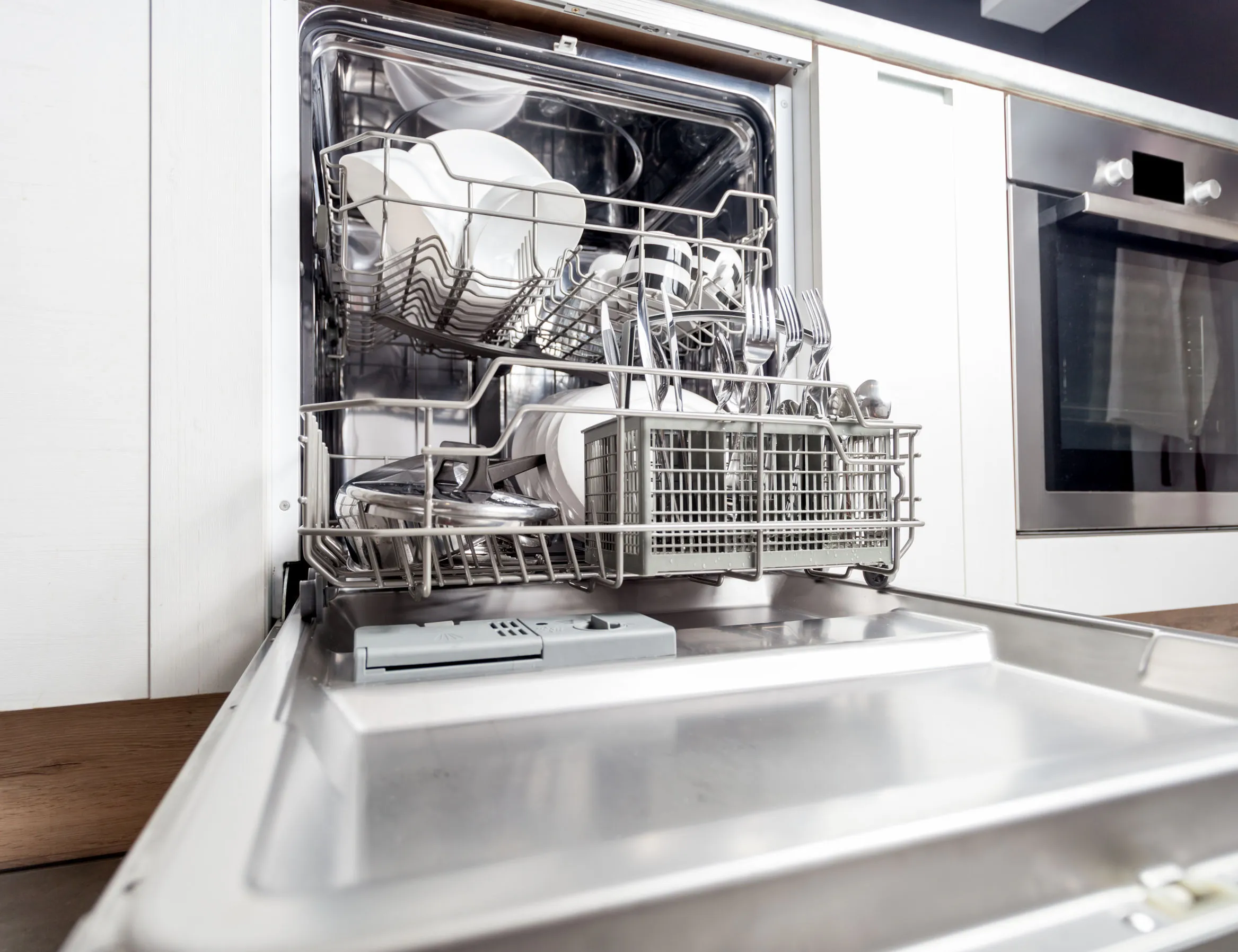 Full open dishwasher.