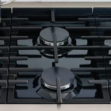 Bosch Black gas stovetop with two burners and sturdy metal grates on a stainless steel surface.