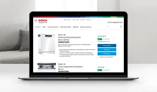 Laptop displaying Bosch home appliances website with product images and descriptions.