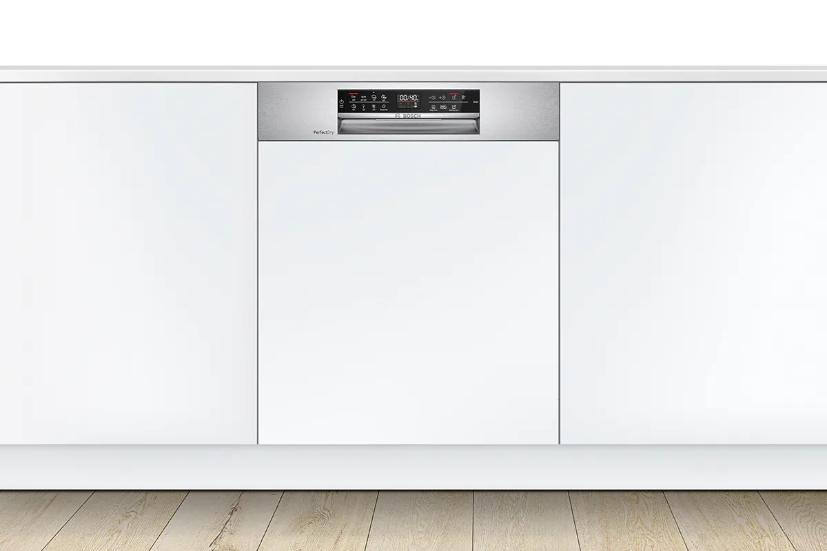 Built-in dishwasher integrated into white kitchen cabinetry with control panel at the top