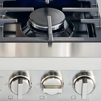 Bosch Stainless steel gas cooktop with three control knobs and a single burner.