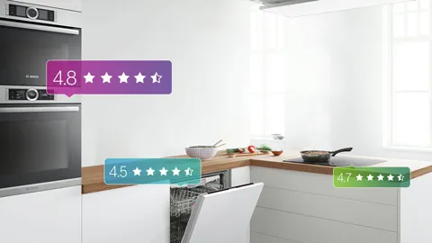 Modern kitchen with appliance ratings displayed on screen.