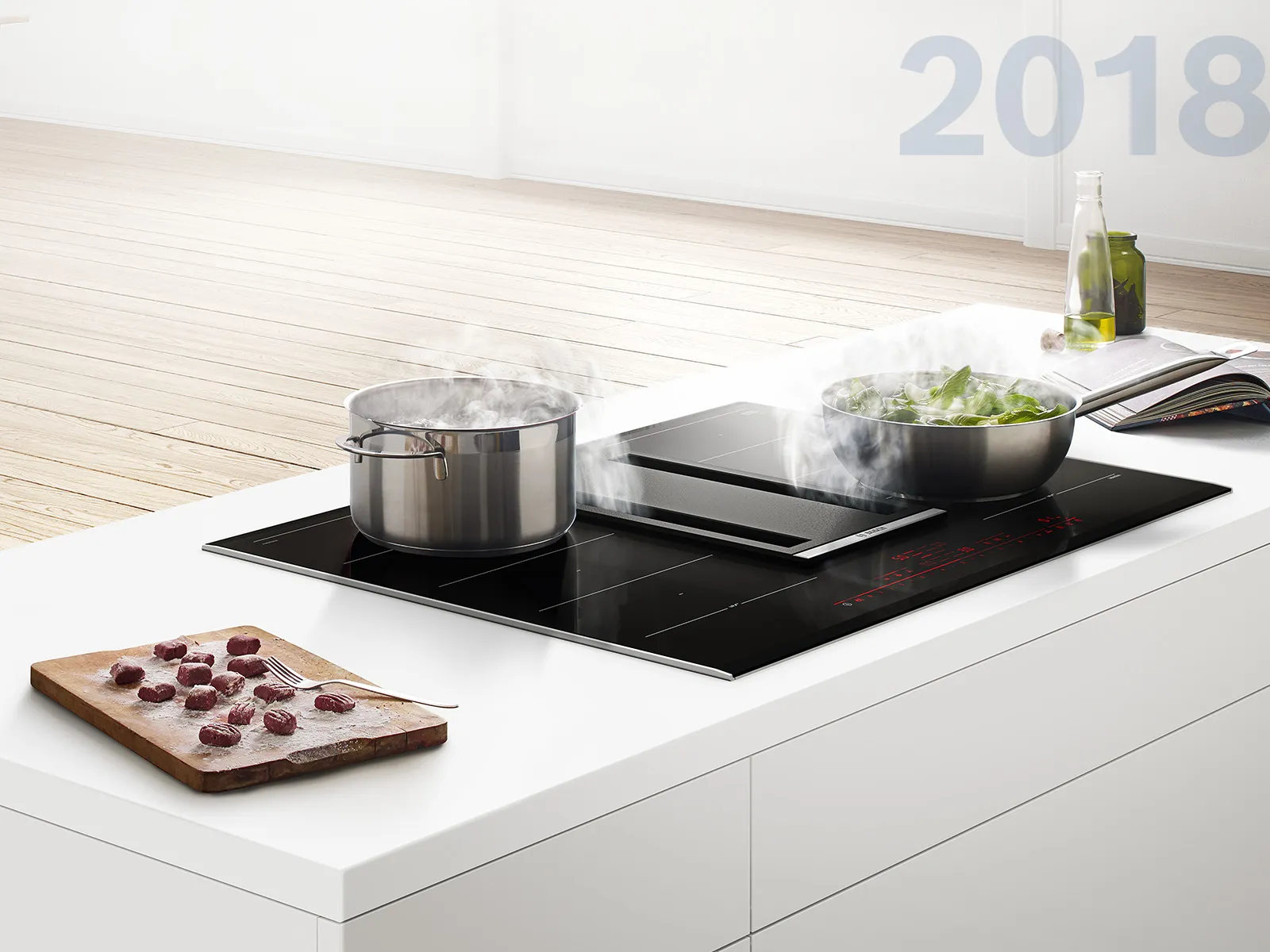 The elegant all-in-one cooktop and hood.