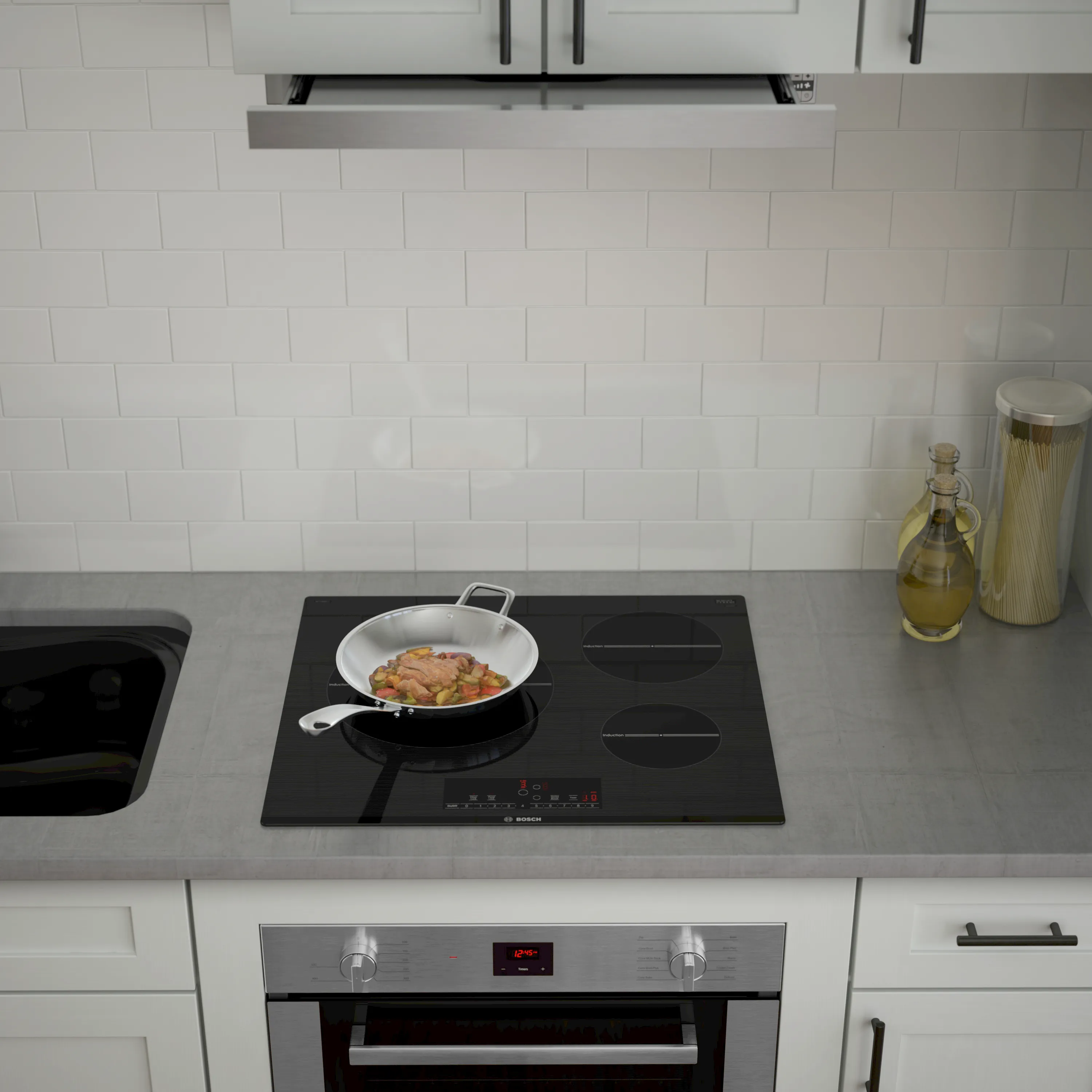 Bosch induction cook top with a compact wall oven  and a gray countertop
