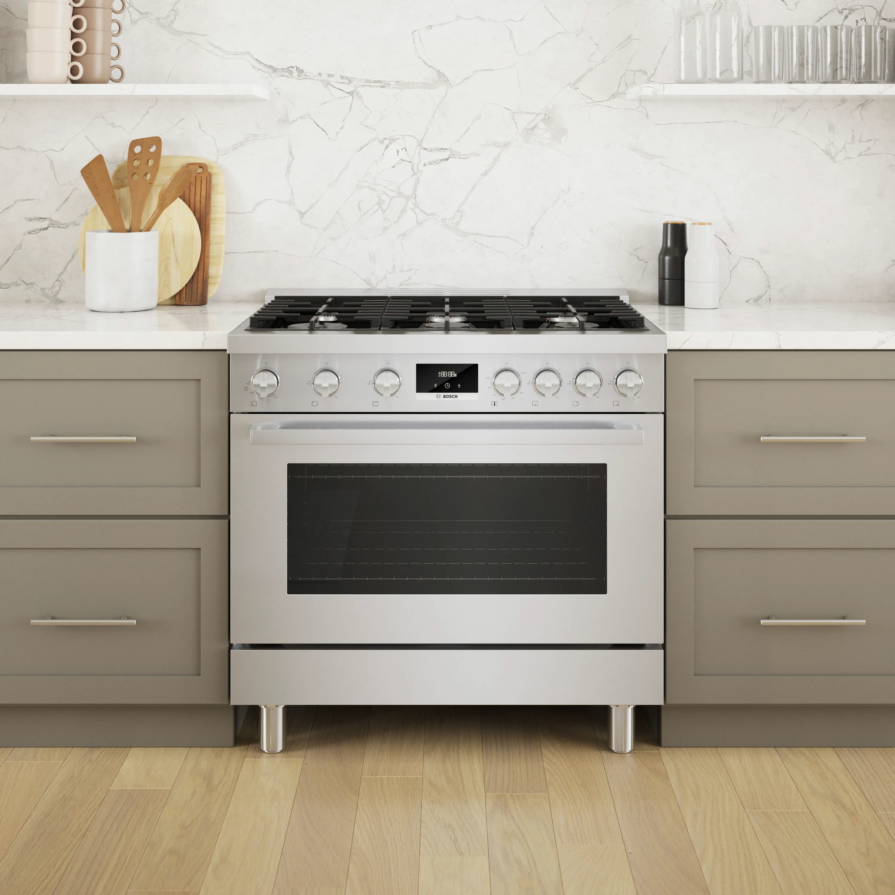 Bosch Stainless steel gas stove with oven in a modern kitchen setting with marble backsplash.