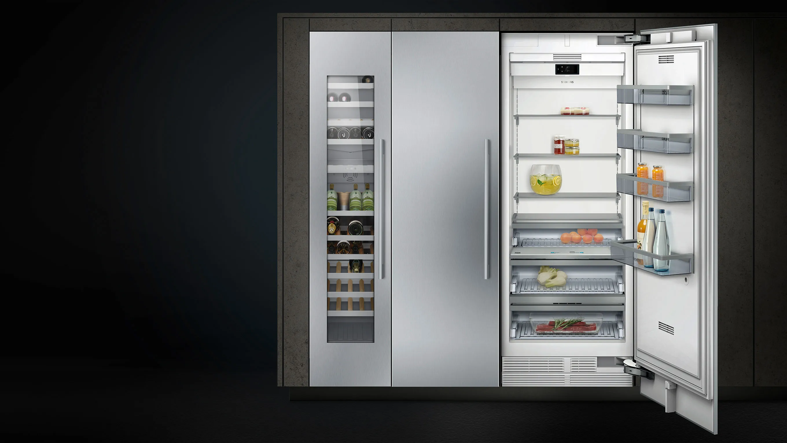 Open refrigerator with various food items, shelves, and drawers visible.
