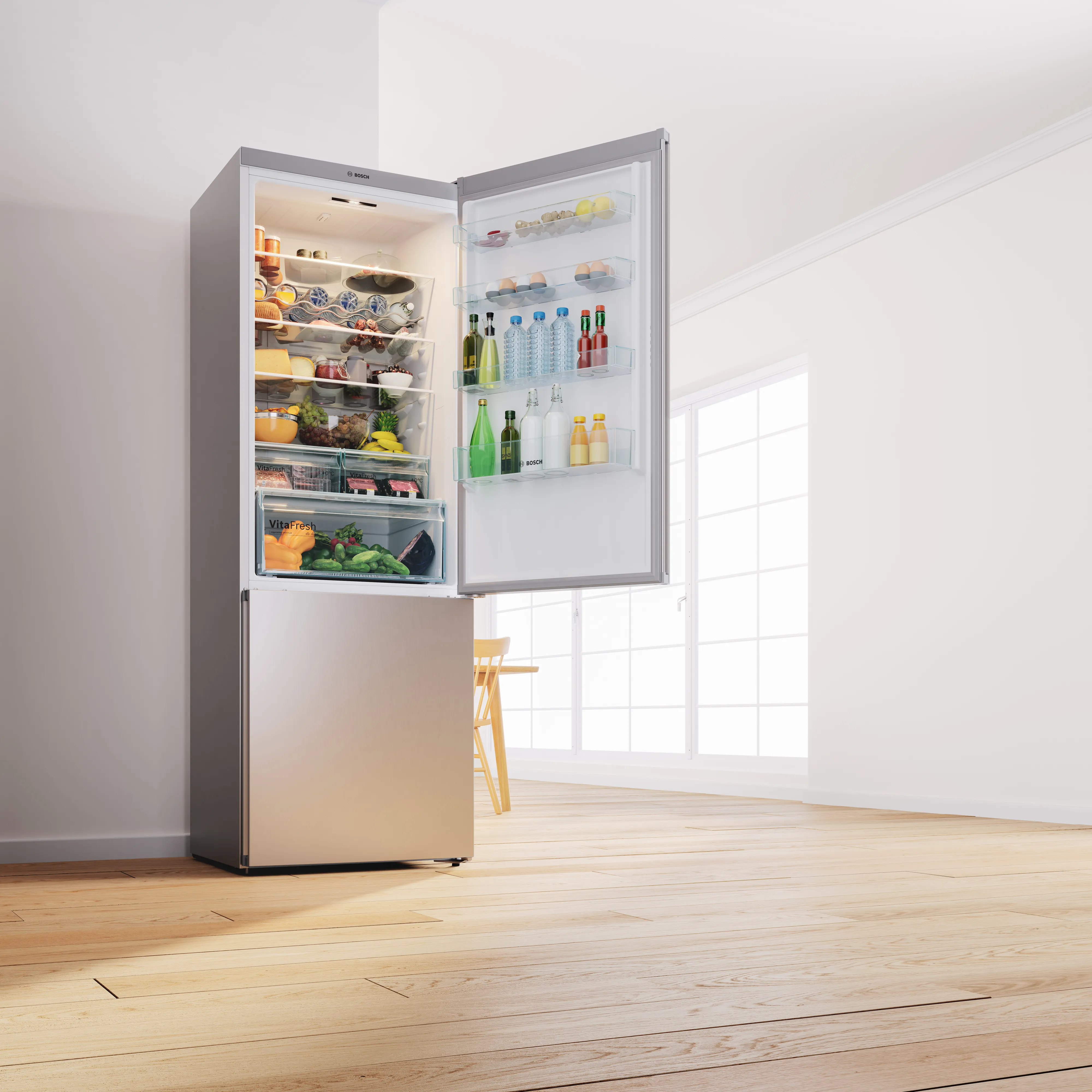 Frigorifero aperto riempito con vari prodotti alimentari e bevande in una cucina luminosa e moderna