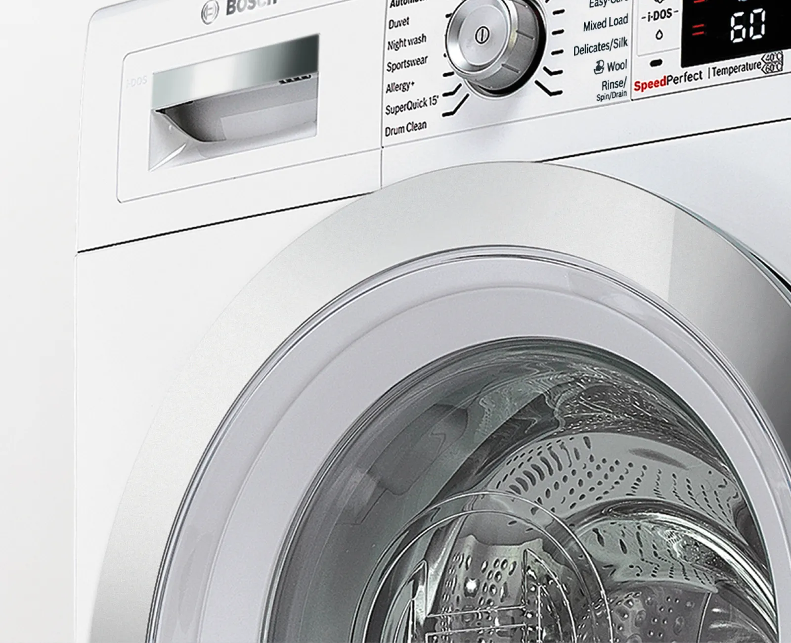 Front‑loading washing machine door and control panel.