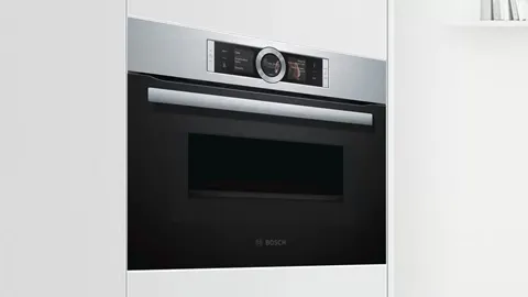 Modern built-in oven with digital display and control panel.