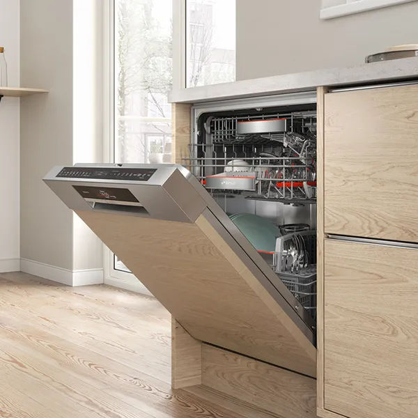 Open built-in dishwasher in the kitchen.