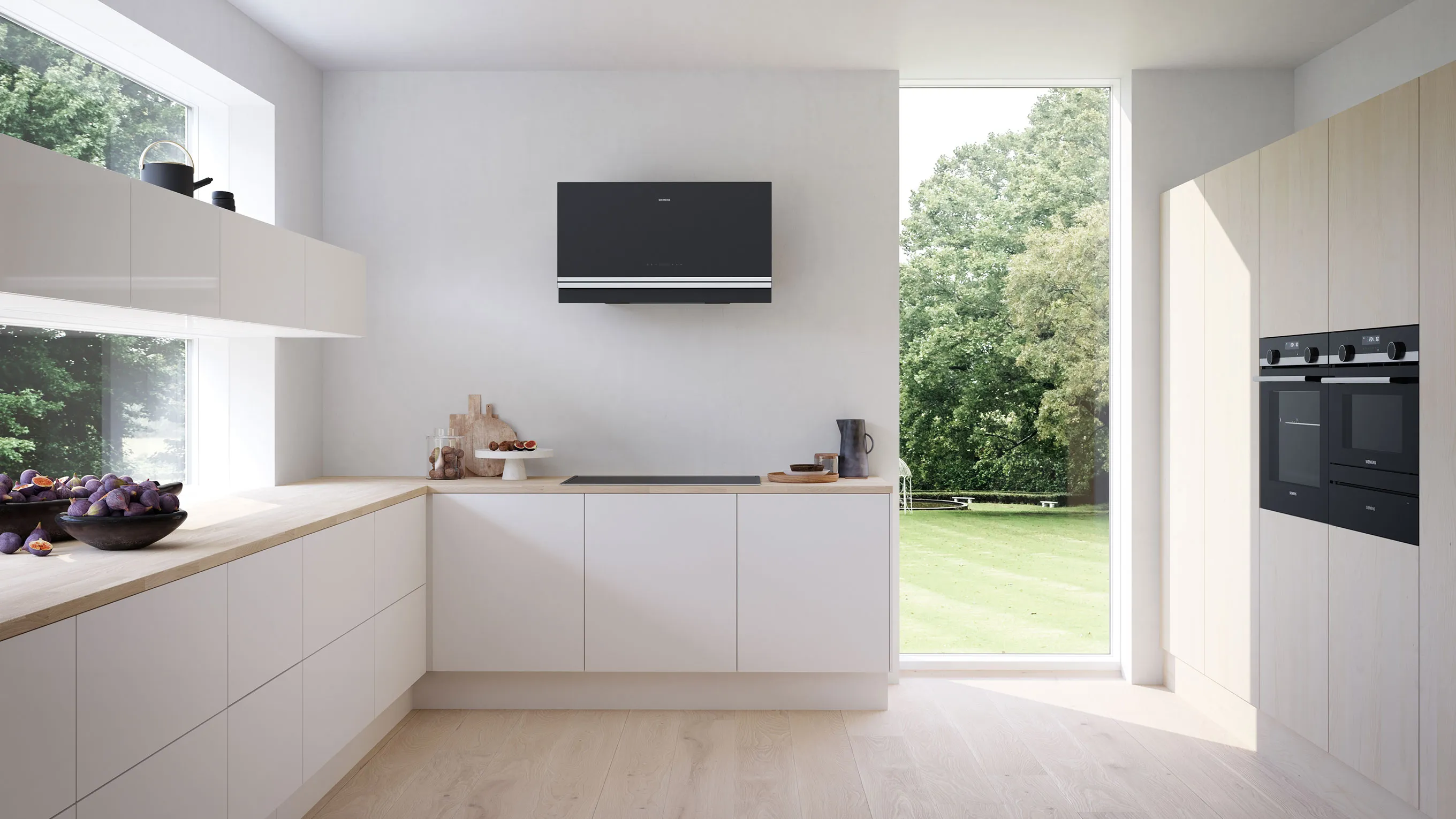 Modern kitchen with white cabinets, wooden countertops, and large windows overlooking a grassy outdoor area.