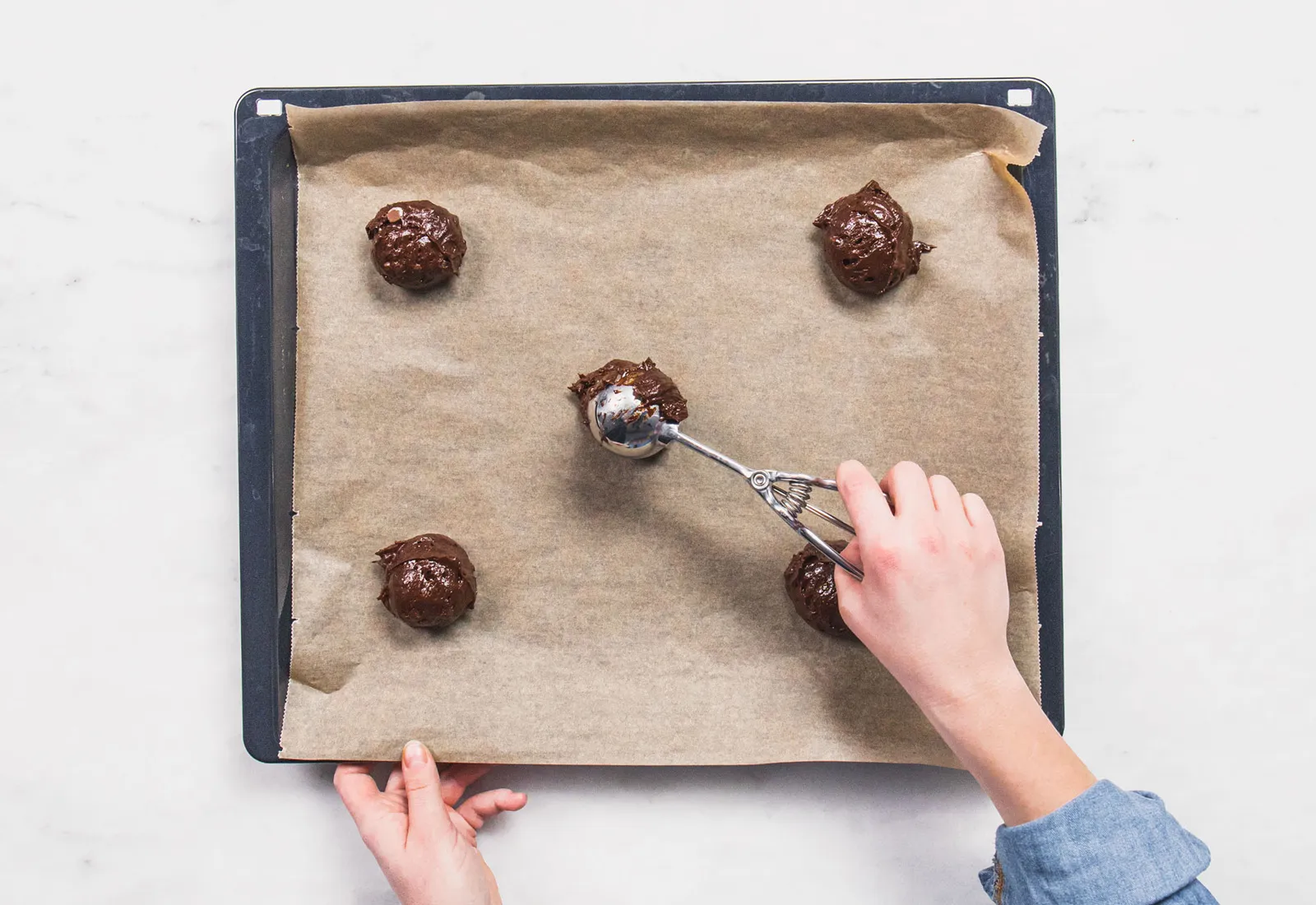 Chocolate brownie cookie batter being mixed with eggs and sugar in a bowl, step-by-step baking process