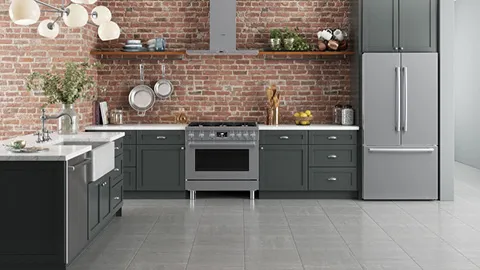 Modern kitchen with dark gray cabinets, brick wall, and Bosch stainless steel appliances.