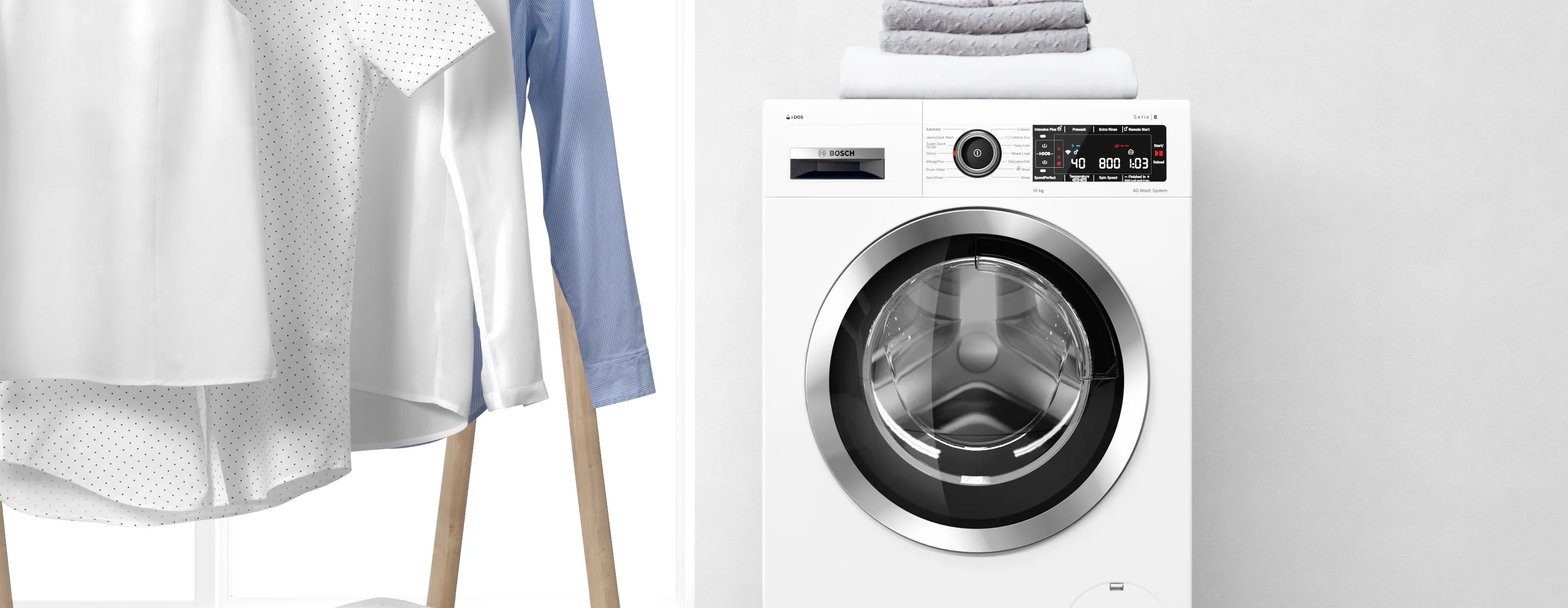 Bosch washing machine with clean clothes hanging next to it