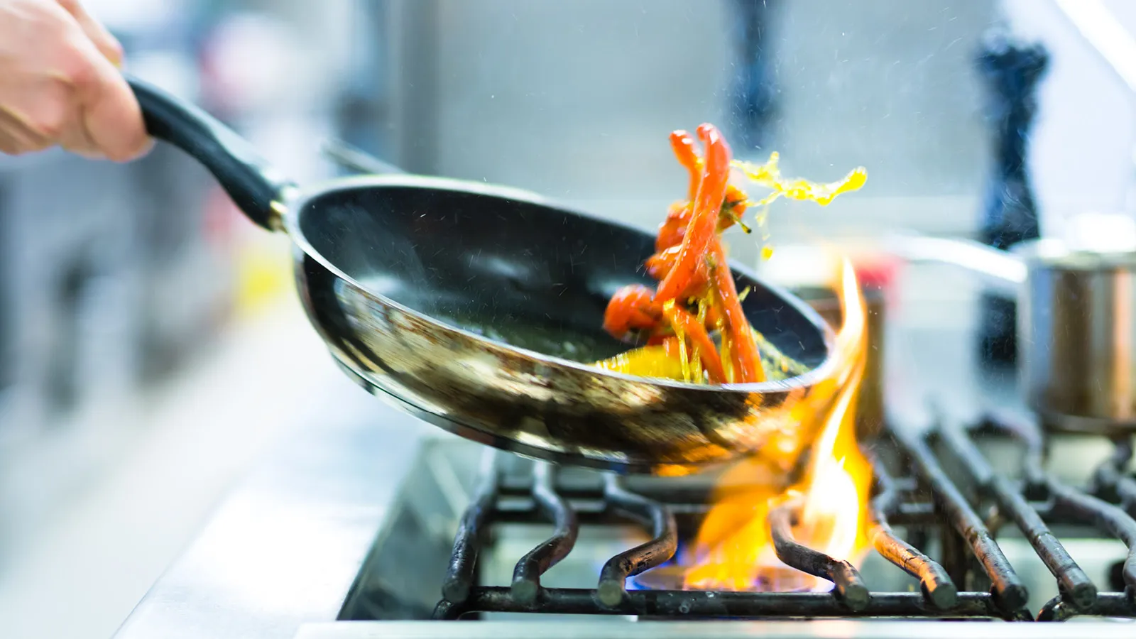Pan cooking over open flame