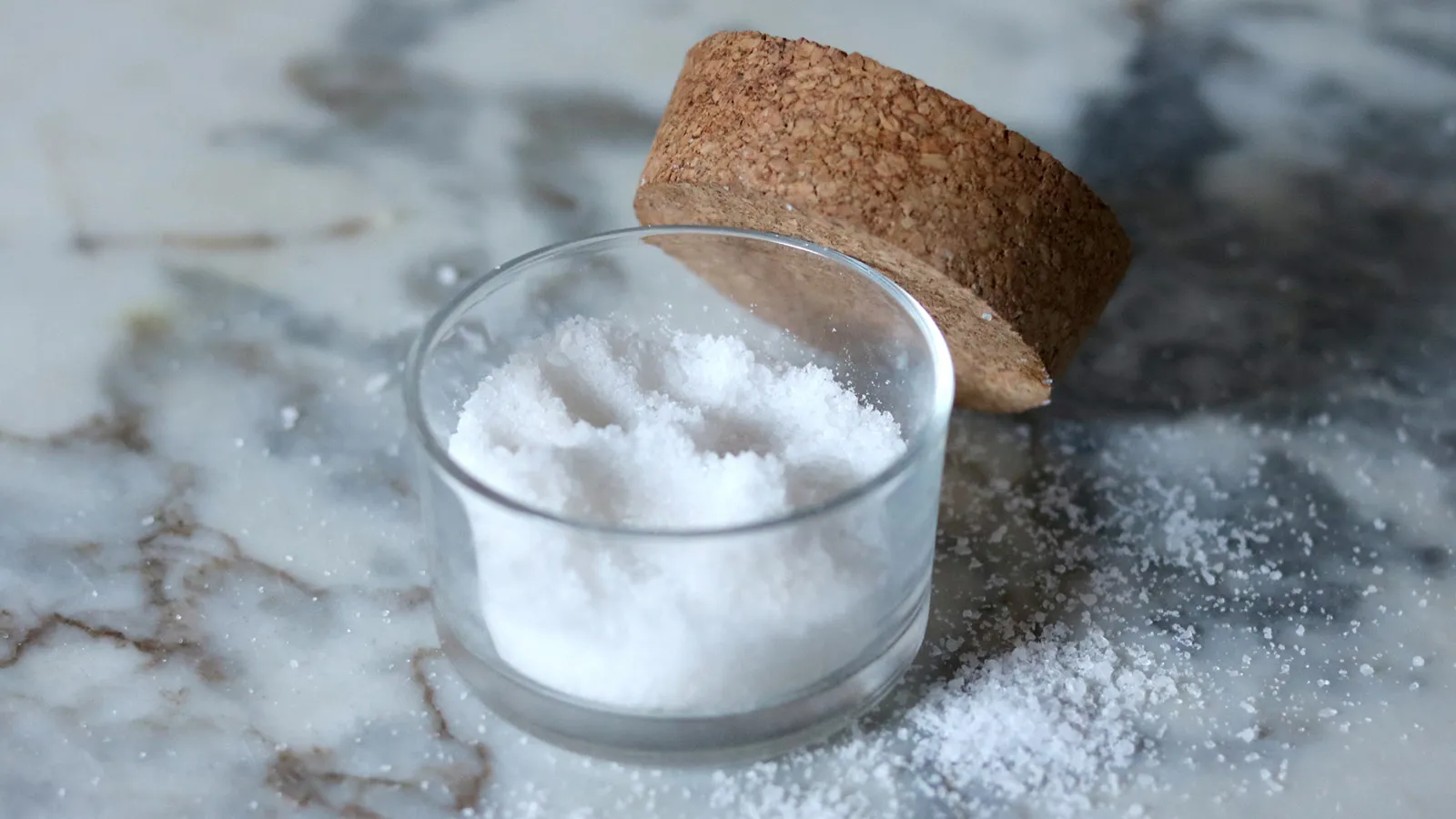 Glass container filled with salt