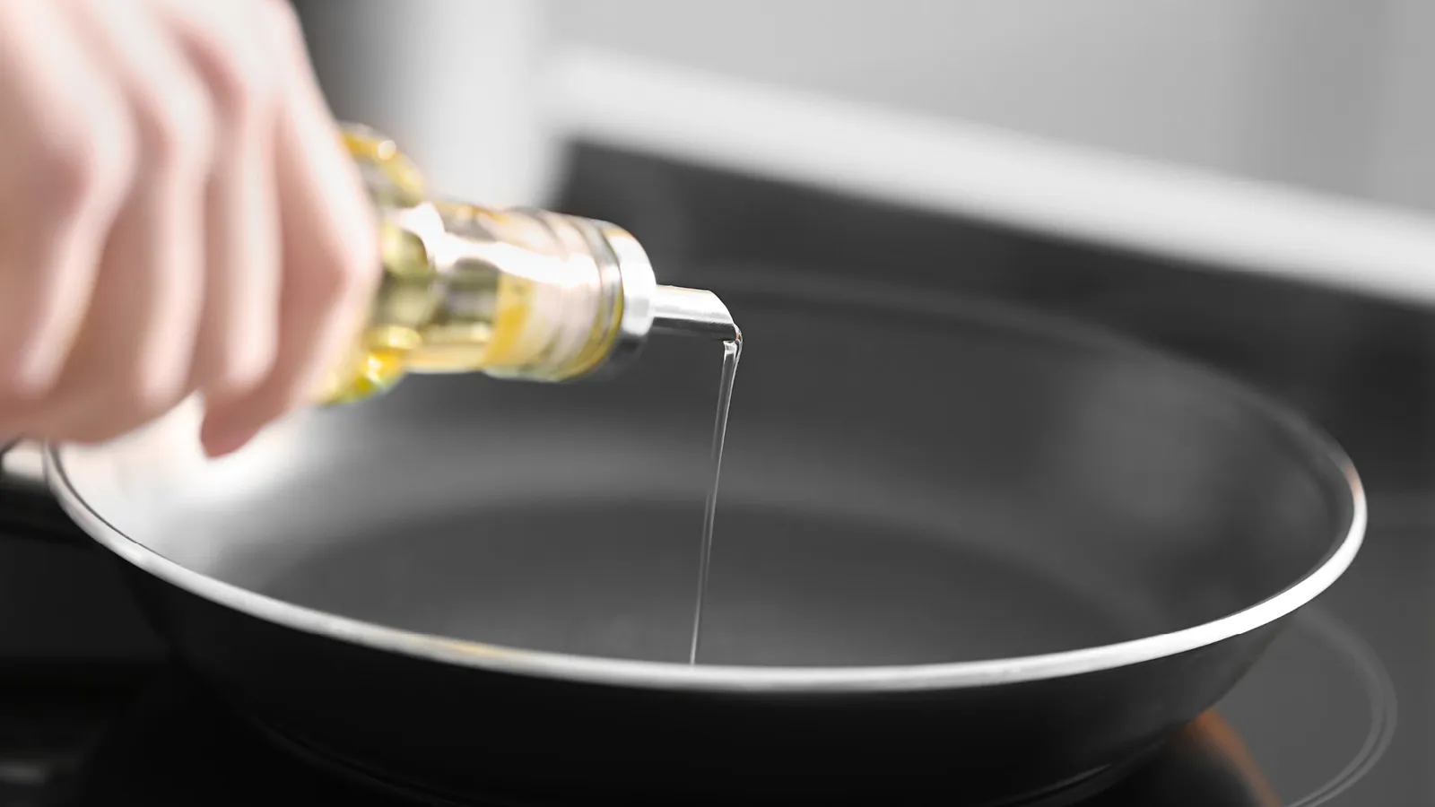 Person cleaning cast iron pan