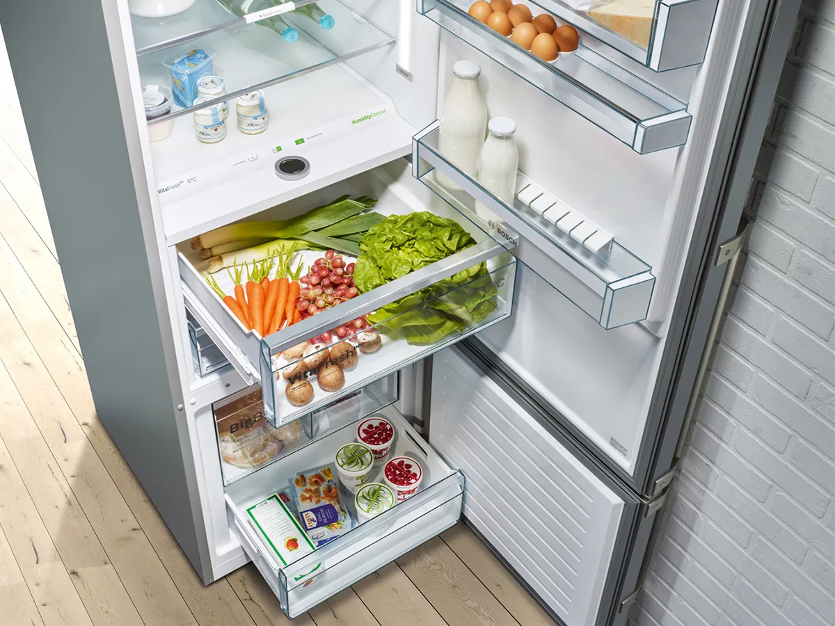 Open fridge freezer with open drawers