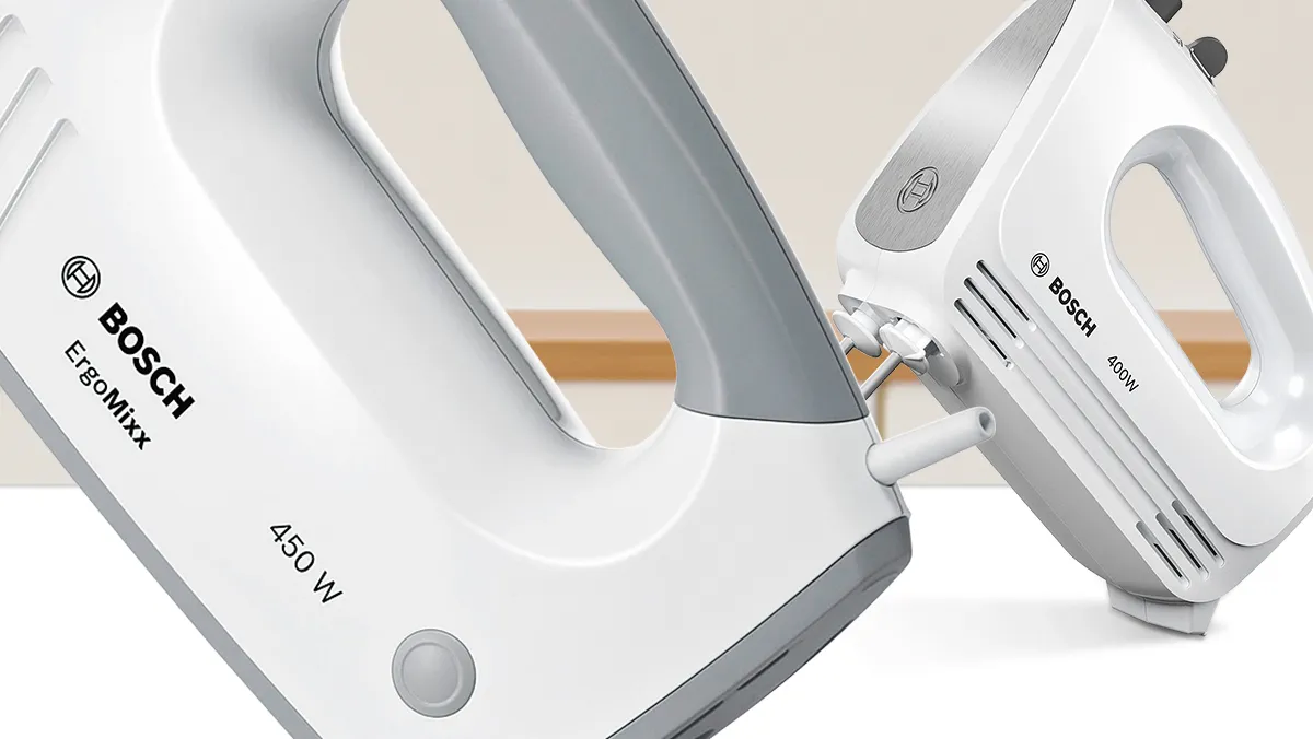 Closeup of 450 watt ErgoMixx hand mixer, a 400 watt hand mixer is behind it.