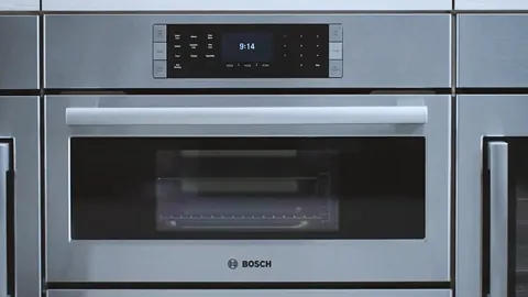 Stainless steel Bosch oven with digital display and control panel.